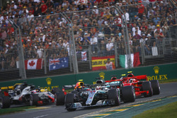 Lewis Hamilton, Mercedes AMG F1 W09, leads Kimi Raikkonen, Ferrari SF71H, Sebastian Vettel, Ferrari SF71H, Kevin Magnussen, Haas F1 Team VF-18 Ferrari, Max Verstappen, Red Bull Racing RB14 Tag Heuer, and the rest of the field at the start