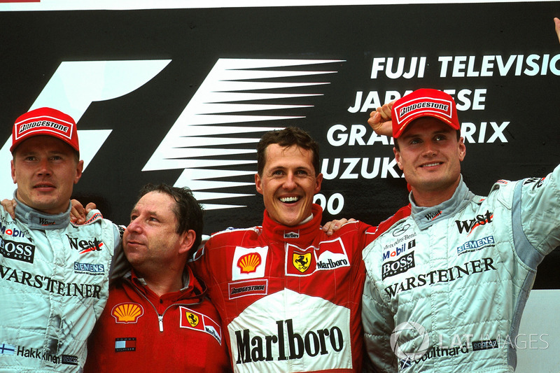 Podium: Mika Hakkinen, Jean Todt, winnaar Michael Schumacher, Ferrari F1 2000 en David Coulthard