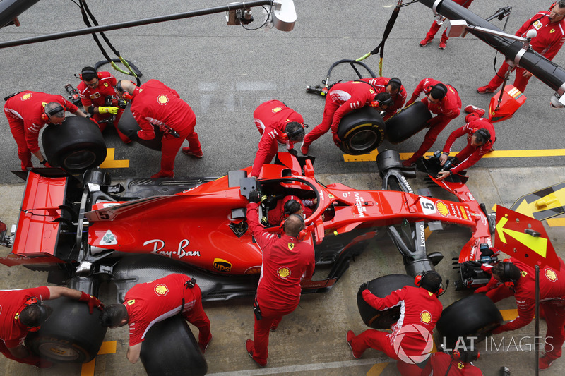 Ferrari engineers practice a pit stop