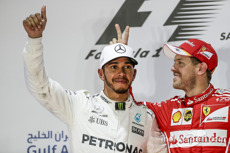 5. Lewis Hamilton, Mercedes AMG, second place, Sebastian Vettel, Ferrari, race winner, on the podium