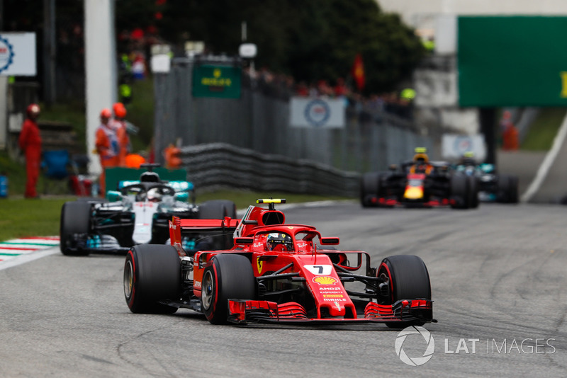 Kimi Raikkonen, Ferrari SF71H, leads Lewis Hamilton, Mercedes AMG F1 W09