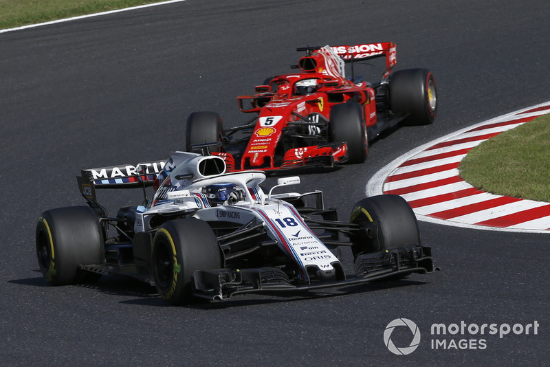 Lance Stroll, Williams FW41 y Sebastian Vettel, Ferrari SF71H