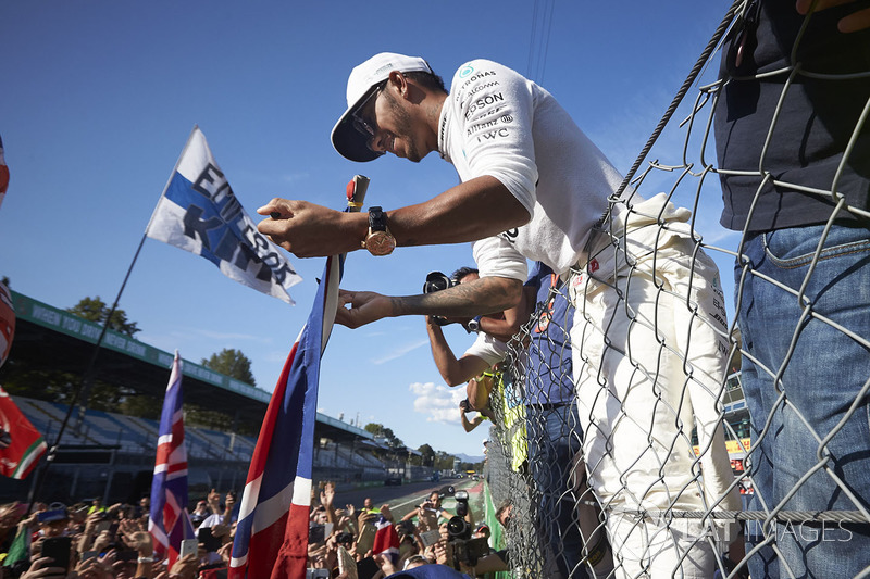 Lewis Hamilton, Mercedes AMG F1, signs autographs for fans