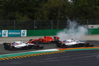 Sebastian Vettel, Ferrari SF71H facing the wrong way after making contact with Lewis Hamilton, Mercedes AMG F1 W09 while Lance Stroll, Williams FW41, Sergey Sirotkin, Williams FW41