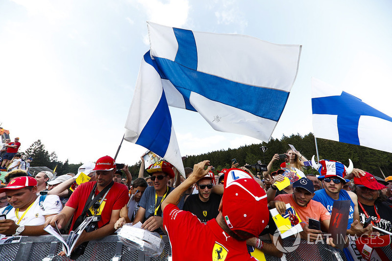 Kimi Raikkonen, Ferrari, signs autographs for fans