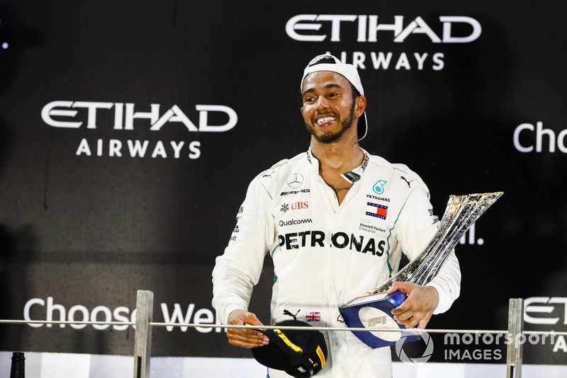 Lewis Hamilton, Mercedes AMG F1, 1st position, on the podium with his trophy