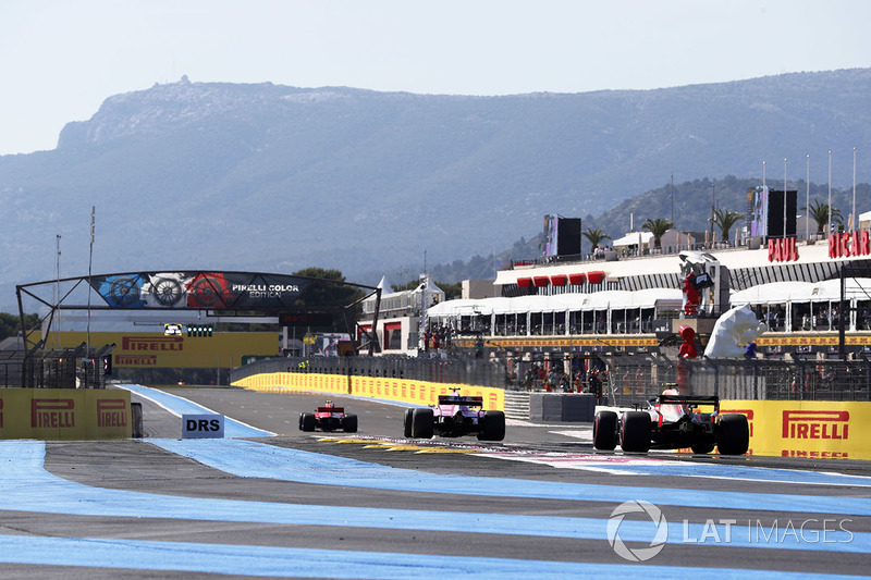 Max Verstappen, Red Bull Racing RB14, chases Esteban Ocon, Force India VJM11, and Kimi Raikkonen, Ferrari SF71H