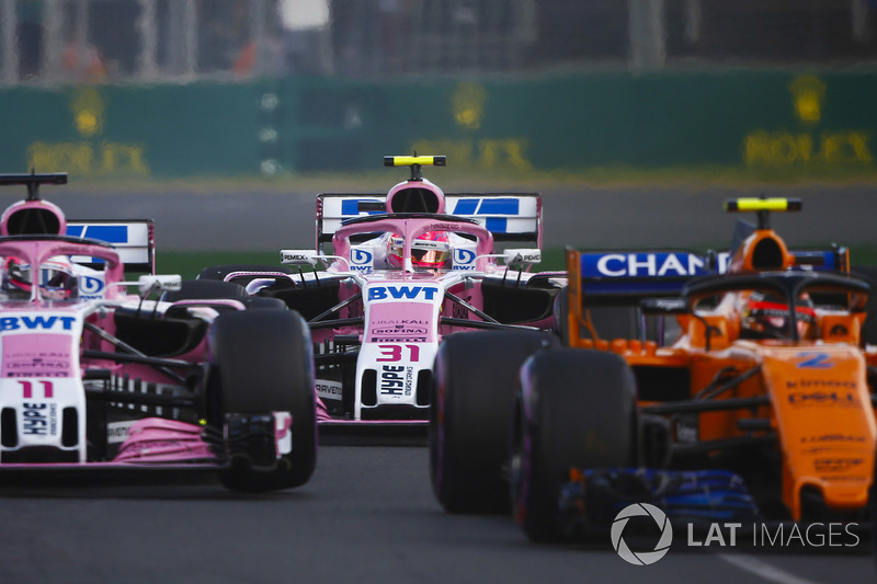 Stoffel Vandoorne, McLaren MCL33 Renault, Sergio Perez, Force India VJM11 Mercedes, and Esteban Ocon, Force India VJM11 Mercedes, at the start