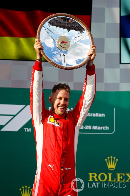 Sebastian Vettel, Ferrari, celebrates victory on the podium