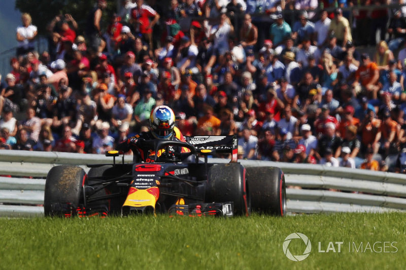 Daniel Ricciardo, Red Bull Racing, exits his car after retiring