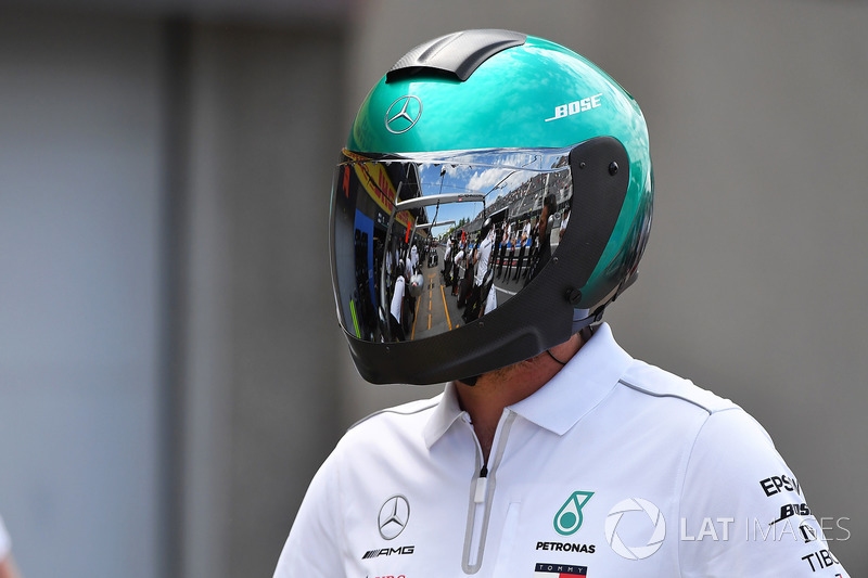 Mercedes AMG F1 mechanic with reflection in helmet 