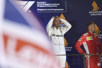 (L to R): Lewis Hamilton, Mercedes AMG F1 and Sebastian Vettel, Ferrari celebrate on the podium