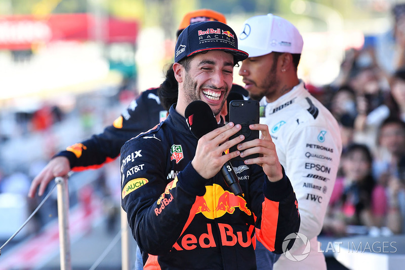 Daniel Ricciardo, Red Bull Racing celebrates with his phone on the podium