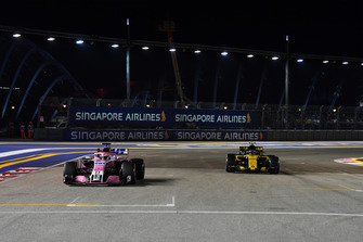 Sergio Perez, Racing Point Force India VJM11 and Carlos Sainz Jr., Renault Sport F1 Team R.S. 18 on the grid