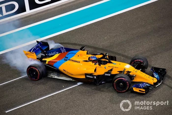 Fernando Alonso, McLaren MCL33, performs donuts on the grid at the end of the race