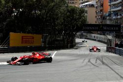 Kimi Raikkonen, Ferrari SF70-H leads Sebastian Vettel, Ferrari SF70-H