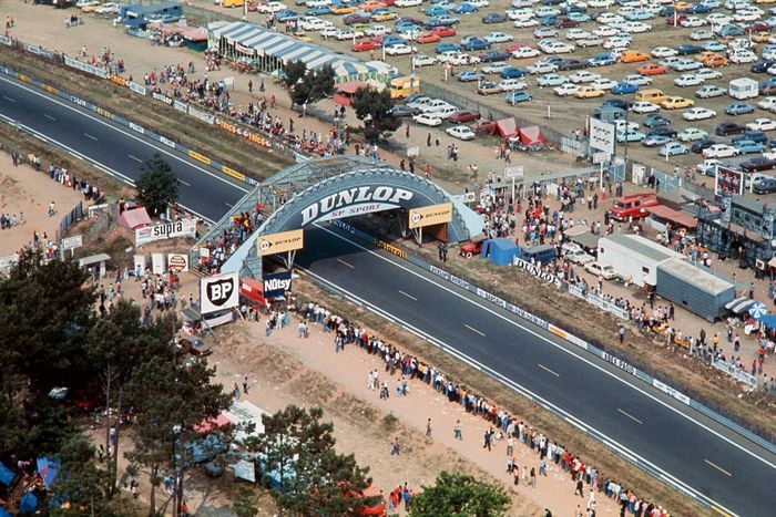 People attend, near the Dunlop footbridge, the 42nd edition of the 24 hours of Le Mans