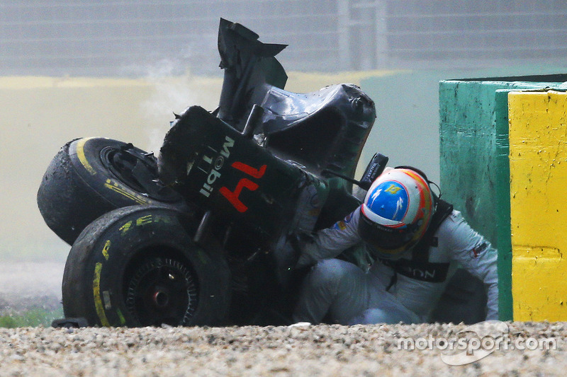 Fernando Alonso, McLaren MP4-31 exits his car after a huge crash