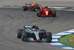 Valtteri Bottas, Mercedes AMG F1 W09, leads Kimi Raikkonen, Ferrari SF71H, and Max Verstappen, Red Bull Racing RB14