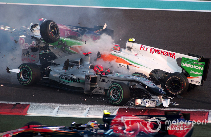 Michael Schumacher, Mercedes GP MGP W01 spins and collects Vitantonio Liuzzi, Force India VJM03