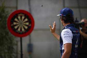 Lance Stroll, Williams Racing, plays darts