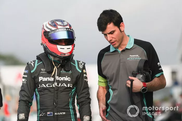 Mitch Evans, Panasonic Jaguar Racing, walks with a team member.