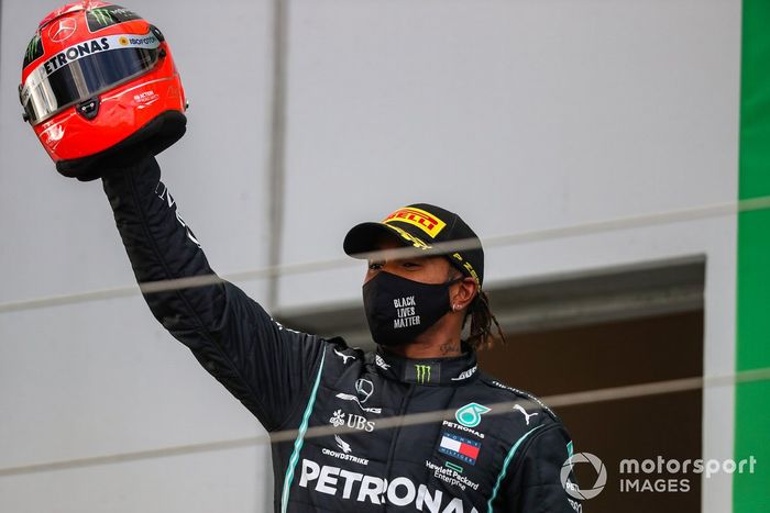 Lewis Hamilton, Mercedes-AMG F1, 1st position, with a helmet worn by Michael Schumacher in 2012