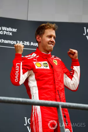 Winner Sebastian Vettel, Ferrari, celebrates on the podium