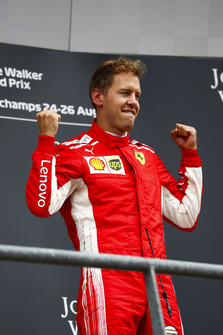 Winner Sebastian Vettel, Ferrari, celebrates on the podium