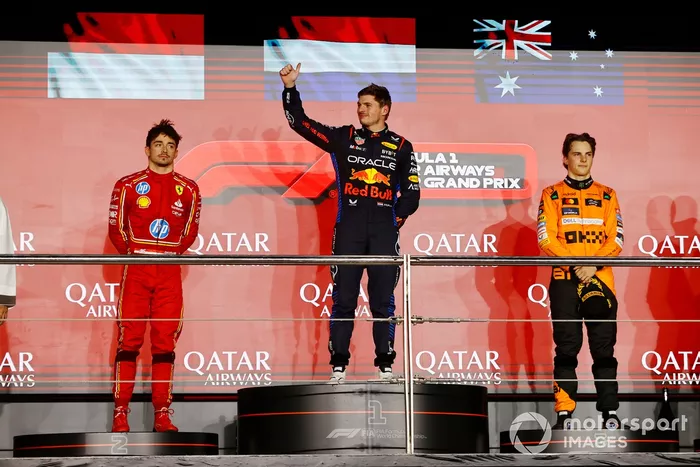 Max Verstappen, Red Bull Racing, 1st position, Charles Leclerc, Scuderia Ferrari, 2nd position, Oscar Piastri, McLaren F1 Team, 3rd position, stand on the podium for the podium ceremony
