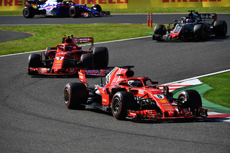 Sebastian Vettel, Ferrari SF71H leads Kimi Raikkonen, Ferrari SF71H and Romain Grosjean, Haas F1 Team VF-18