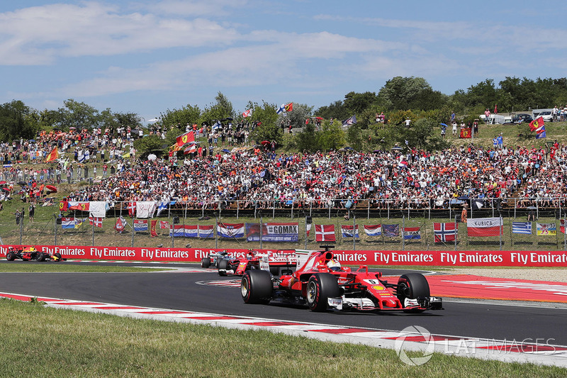 Sebastian Vettel, Ferrari SF70H, leads, Kimi Raikkonen, Ferrari SF70H,