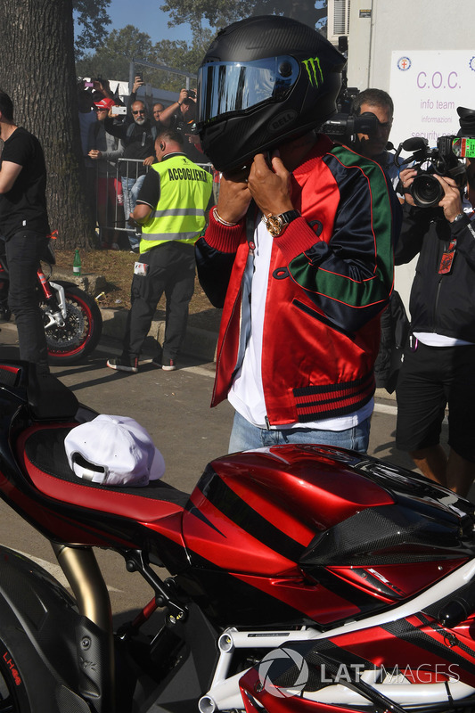 Lewis Hamilton, Mercedes AMG F1 arrives at the track on his motorbike