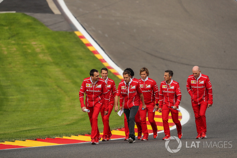 Sebastian Vettel, Ferrari walks the track, Adami, Ferrari Race Engineer, Jock Clear, Ferrari Chief Engineer, trainer Antti Kontsas, the team