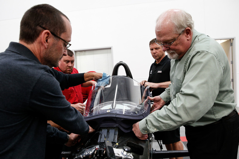 Jeff Horton, INDYCAR Director of Engineering/Safety, installs a windscreen on the 2018 Indy car in preparation for the first test