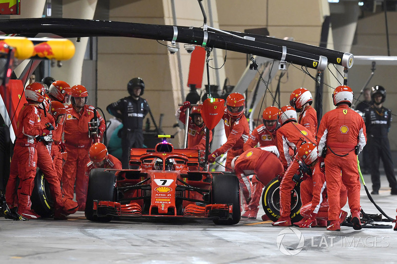 Kimi Raikkonen, Ferrari SF71H hits a mechanic as he leaves the pits