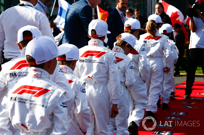 Grid Kids line up for the National Anthem