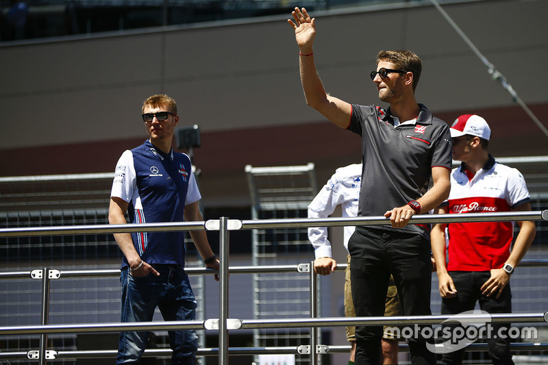 Sergey Sirotkin, Williams Racing, and Romain Grosjean, Haas F1 Team, in the drivers parade