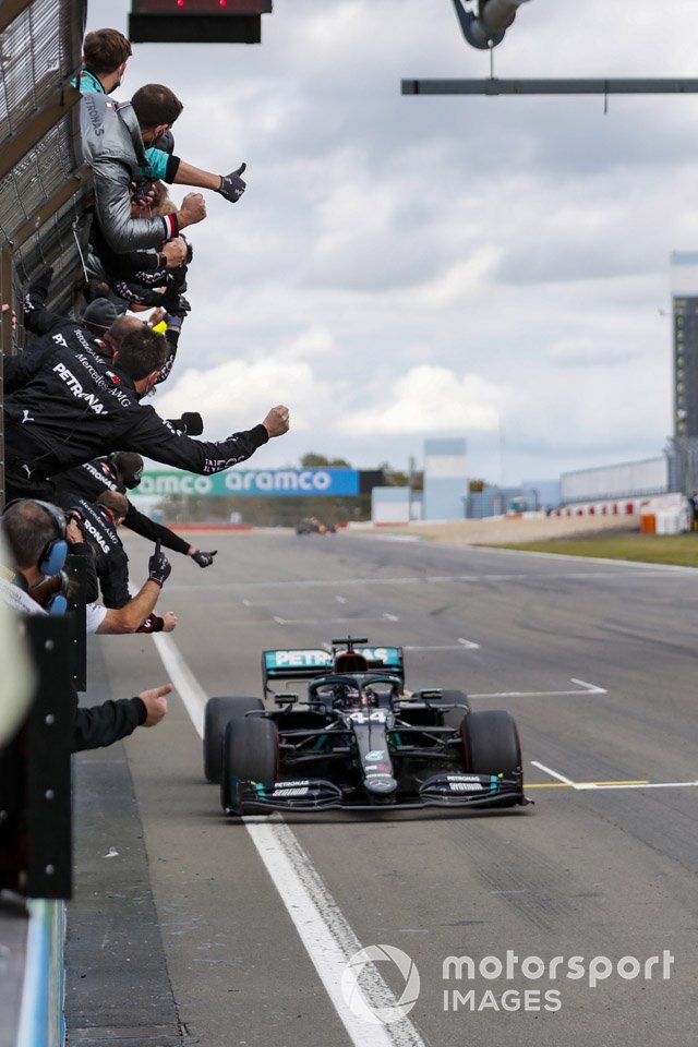 Lewis Hamilton, Mercedes F1 W11, 1st position, crosses the line to the delight of his team