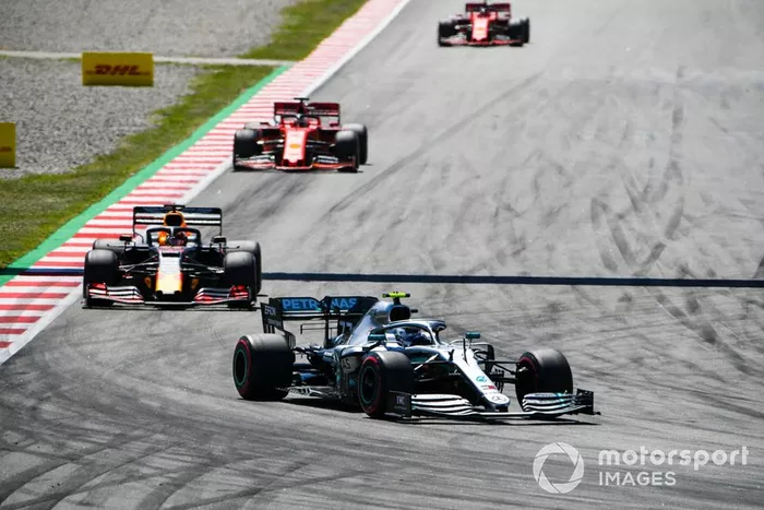 Valtteri Bottas, Mercedes AMG W10, leads Max Verstappen, Red Bull Racing RB15, and Sebastian Vettel, Ferrari SF90