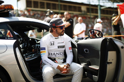 Fernando Alonso, McLaren, sits in an official car