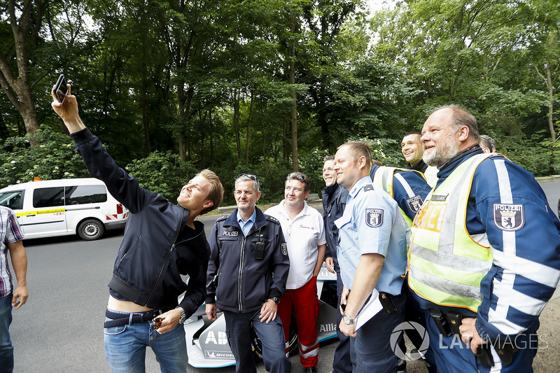 Formula 1 World Champion, Nico Rosberg with local police taking a selfie with the Gen2 Formula E car