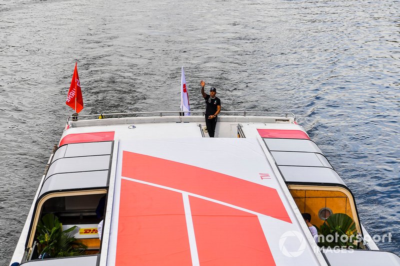 Lewis Hamilton, Mercedes AMG F1 waves to fans from the boat on the way to the Federation Square event