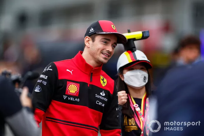 Charles Leclerc, Ferrari, poses with a fan