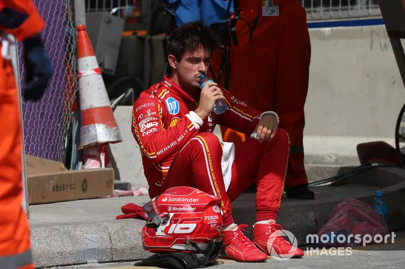 Charles Leclerc, Scuderia Ferrari, sits down after crashing into the barrier