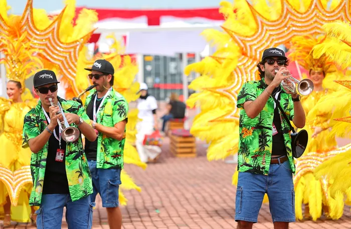 Performers play trumpets