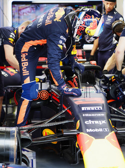 Daniel Ricciardo, Red Bull Racing, climbs in to his cockpit which is fitted, the Halo cockpit protection system