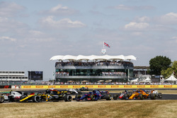 Carlos Sainz Jr., Renault Sport F1 Team R.S. 18, leads Pierre Gasly, Toro Rosso STR13, and Fernando Alonso, McLaren MCL33