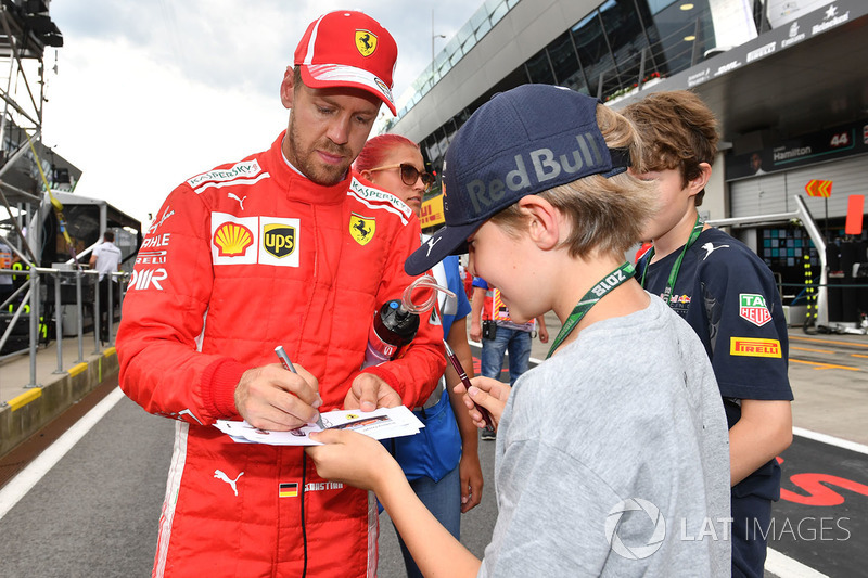 Sebastian Vettel, Ferrari signs autographs