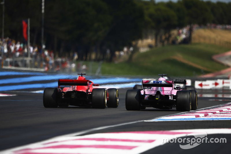 Sebastian Vettel, Ferrari SF71H, passes Sergio Perez, Force India VJM11